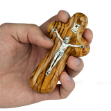 olive wood prayer comfort cross being held in hand