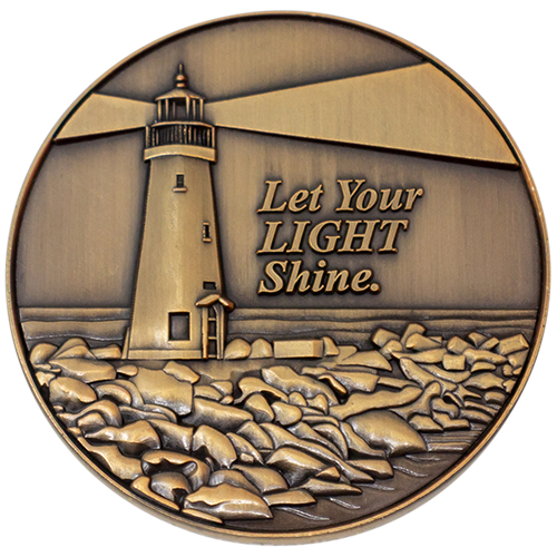 Front: Lighthouse on the coast, with text, 