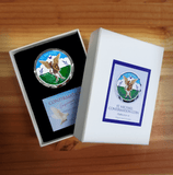 St. Michael Confirmation Coin and Gifts of the holy spirit card in coin box on wooden desk