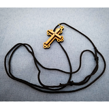 Olive Wood Raised Filigree Bottony Cross Necklace showcasing its cord