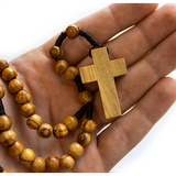 Olive Wood Robe Rosary with Dangling Cross Pendant close view of cross