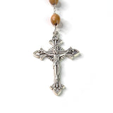 Close-up showing the detail of the INRI crucifix cross pendant