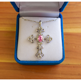 This Antique Pink Tourmaline October Birthstone Cross Pendant comes with an 18" sterling silver chain with a spring-ring clasp and is packaged in a luxurious plush velvet box.