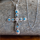 This stunning antique Blue Topaz December Birthstone Cross Pendant merges the old with the new in a modern take on antique styling. 