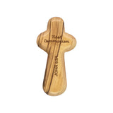 Wooden cross with 'First Communion' and 'John 6:51' inscriptions on a white background