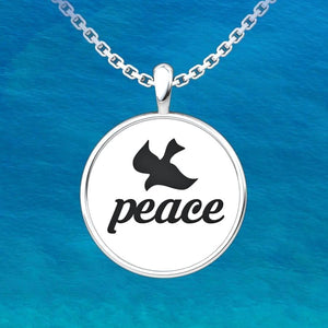Peace Sterling Silver Pendant with an 18 inch chain with an ocean background