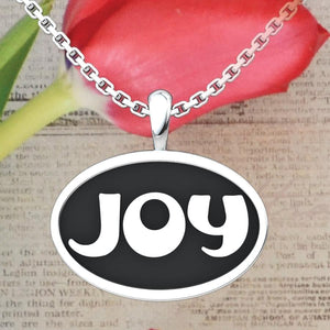 Joy Sterling Silver Pendant with a newspaper and rose background