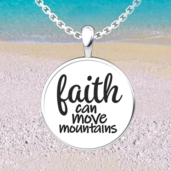 Women's Faith Sterling Silver Pendant on an 18 inch chain on the beach