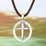 Nailed Sterling Silver Cross Pendant with suede cord with a nature background