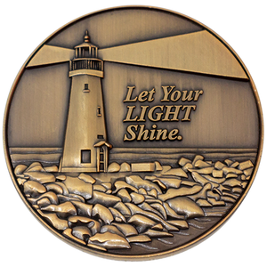 Front: Lighthouse on the coast, with text, "Let your light shine."