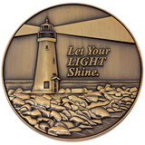 Front: Lighthouse on the coast, with text, "Let your light shine."