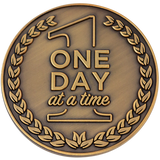 Front: Text, "One day at a time"