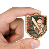 Hand holding Armor of God Shield Challenge Coin