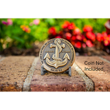 silver challenge coin display with coin in front of flowers