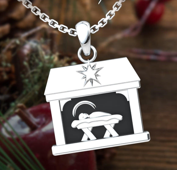 Nativity Sterling Silver Necklace with 18 inch chain and red and green background 