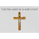 crucifix cross and inri plaque hanging on a wall using the hanging hall