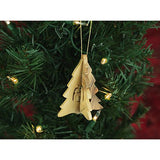 wooden hanging pine tree nativity ornament on a christmas tree with lights