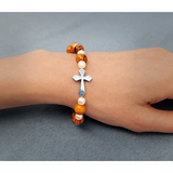 Olive Wood Stretch Bracelet, White Bears and Inlet Cross on female wrist
