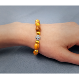 Olive Wood Stretch Bracelet, Golden Bears and Inlet Cross on female wrist