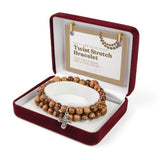 Twist Stretch Bracelet with Olive Wood Beads and Cross Dangle in Velvet Box