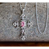 This stunning Antique Pink Tourmaline October Birthstone Cross Pendant merges the old with the new in a modern take on antique styling.